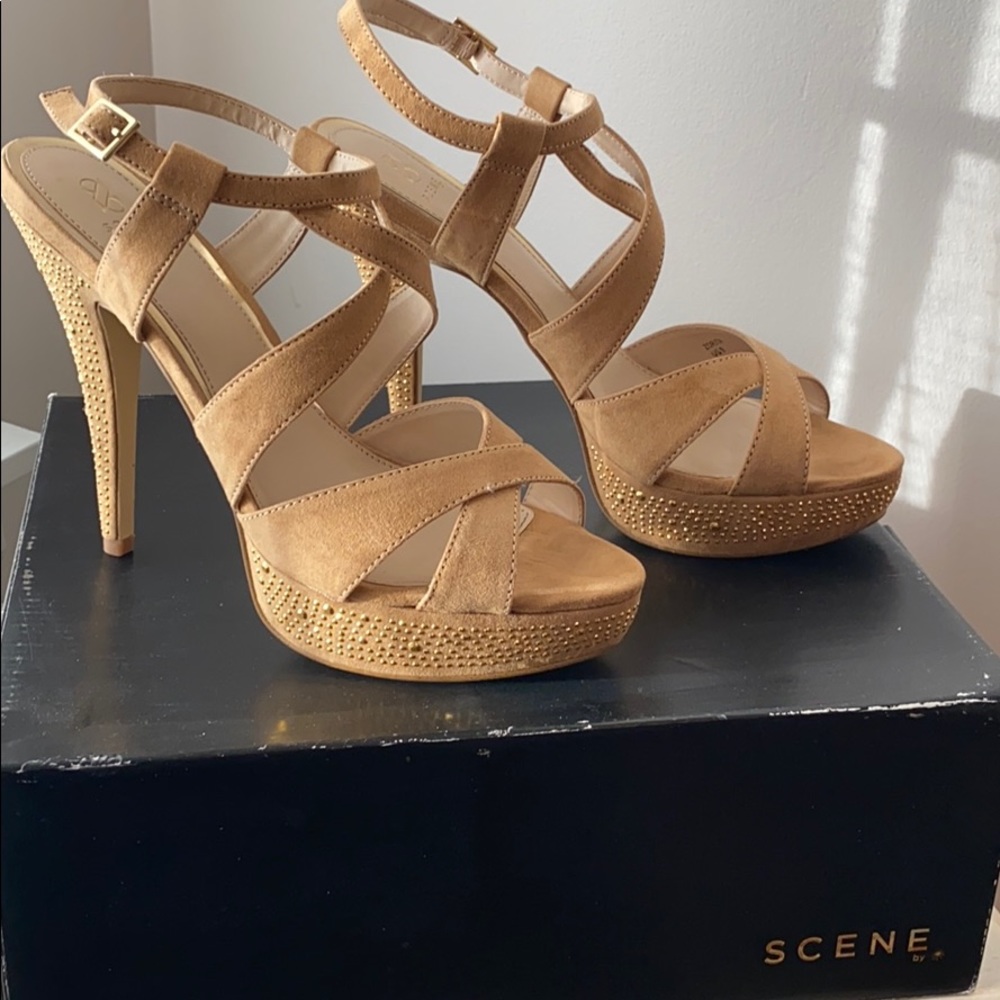 Tan heels with gold studs.